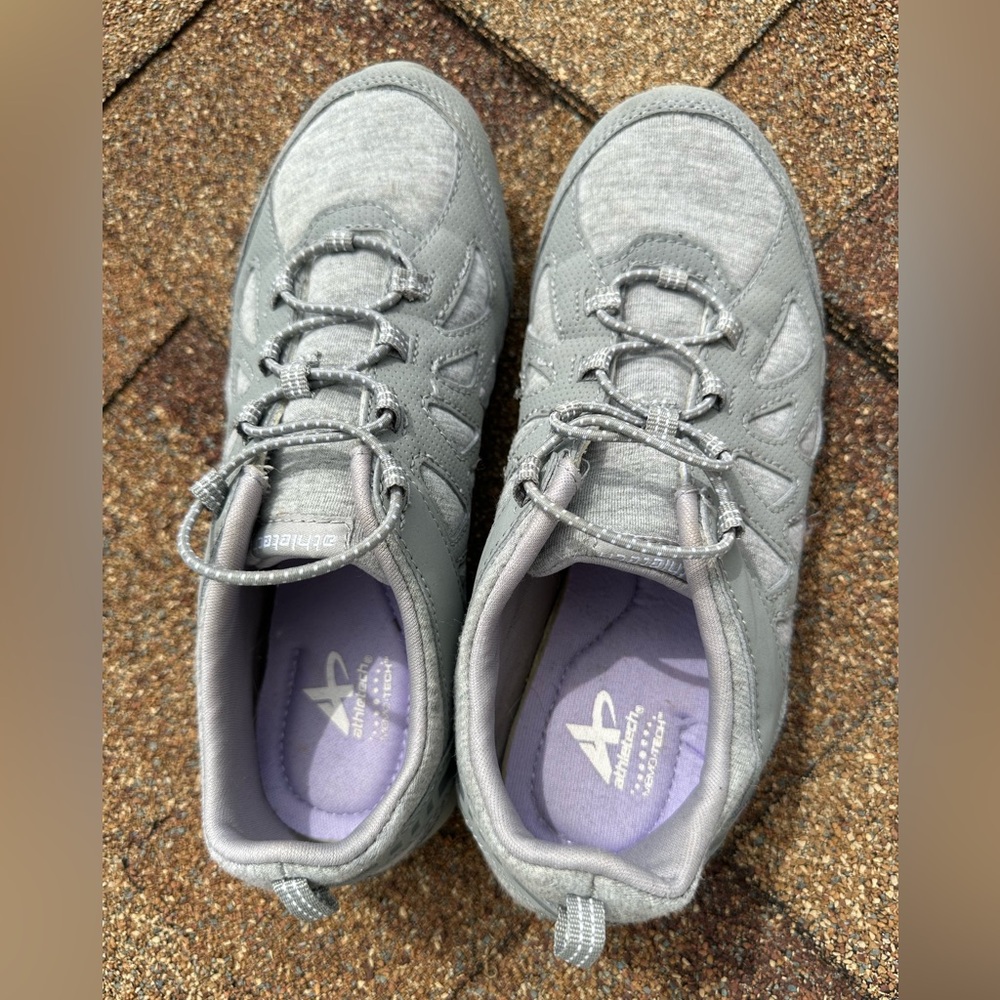 Athletic running or walking shoes with great comfort inside .
